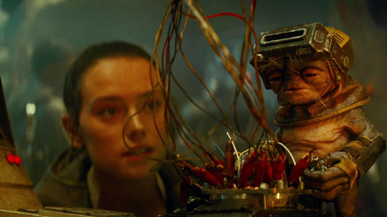 Rey watching Babu Frik work in Star Wars: The Rise of Skywalker