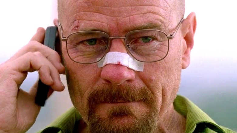 Walter White bandage on nose talks on phone