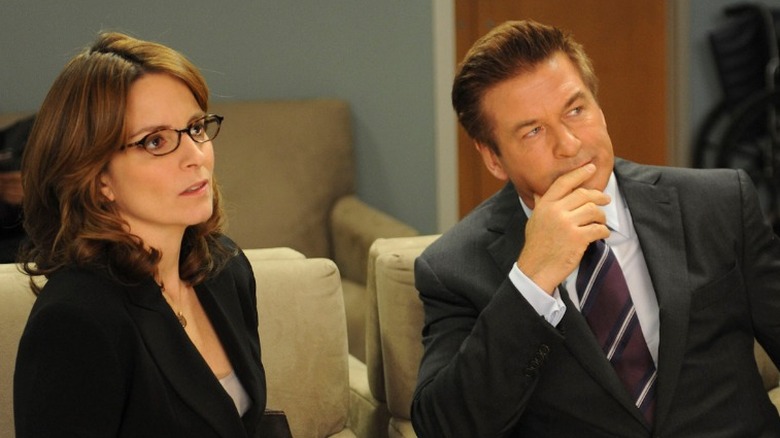 Liz Lemon and Jack Donaghy look worried in an office in 30 Rock