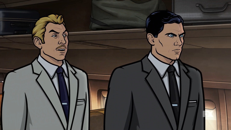 Ray Gillette (Adam Reed) and Sterling Archer (H. Jon Benjamin) stand glaring on a plane in Archer