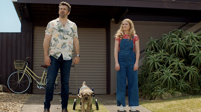 Gordon and Ashley walk their dog in Colin from Accounts