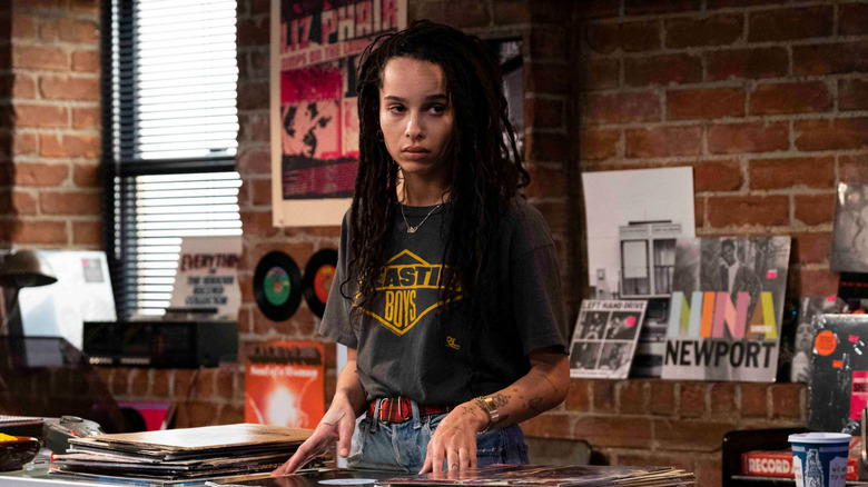 Zoë Kravitz stands in a record shop