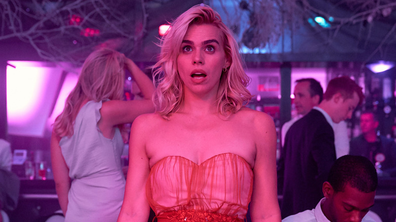 Billie Piper looks off at something in shock