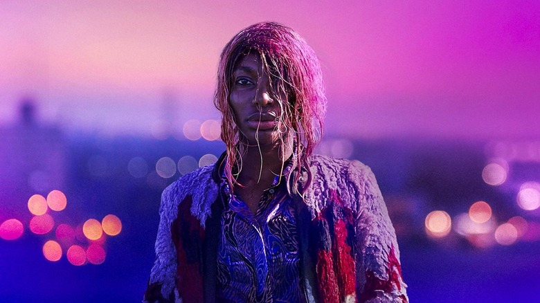 Michaela Coel with wet hair looks into the camera