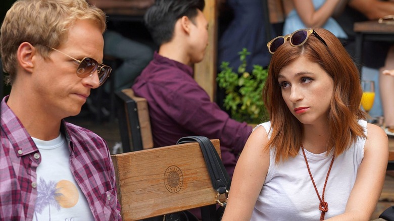 Aya Cash looks sassily at a grimacing Chris Geere