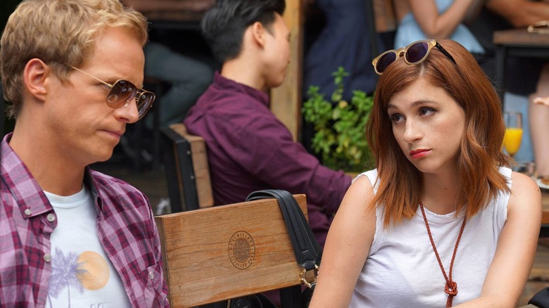 Aya Cash looks sassily at a grimacing Chris Geere