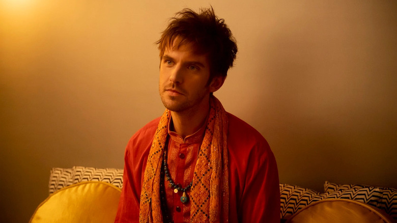 Dan Stevens as David Haller sitting down
