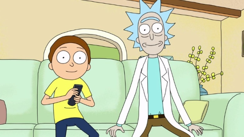 Rick and Morty smiling and watching television