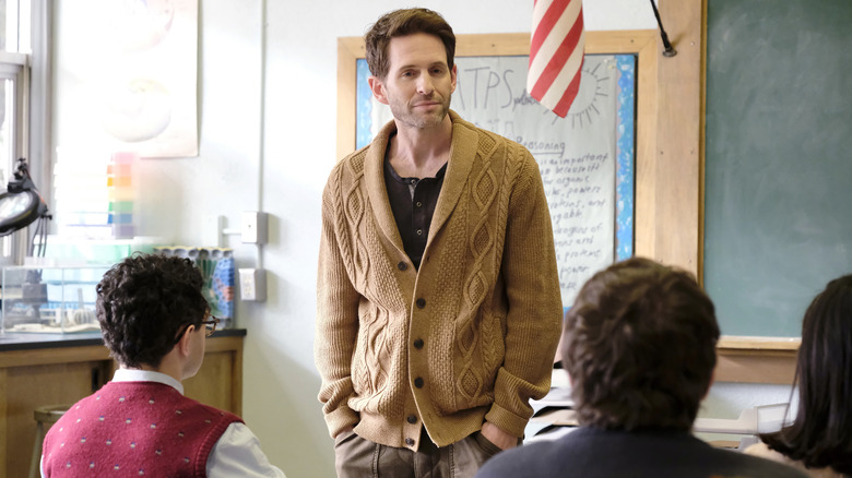 Glenn Howerten looking at student