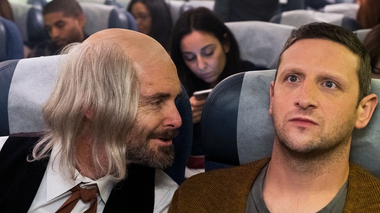 Tim Robinson next to creep on plane
