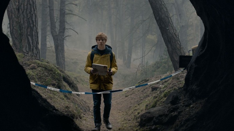 Jonas standing outside cave in Dark