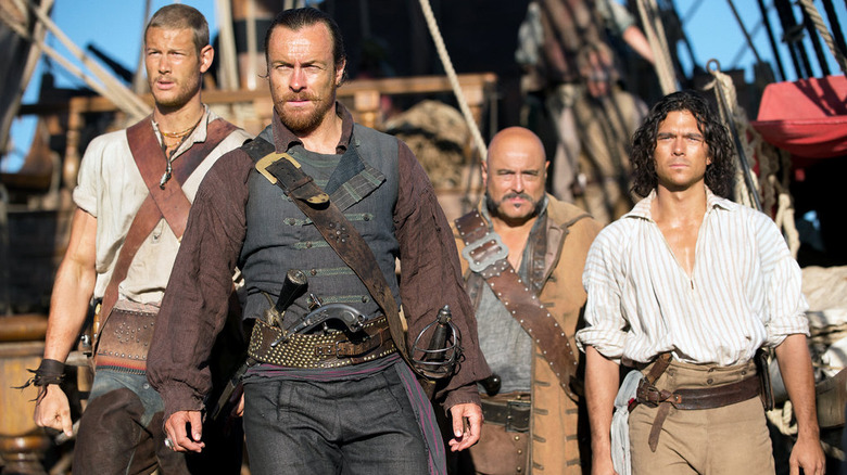 Black Sails pirates stand on ship