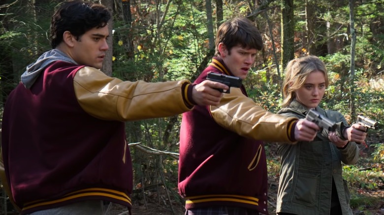 Kathryn Newton fires a gun