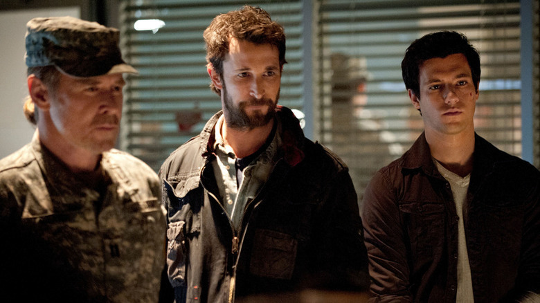 Falling Skies' Noah Wyle standing with son and military commander