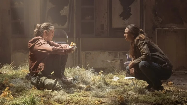 The Last of Us' Bella Ramsey and Anna Torv sitting in building 
