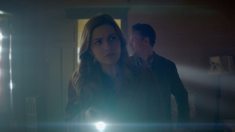 Nancy investigates with a flashlight