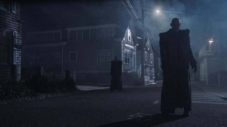 A vampire walks a moonlit street