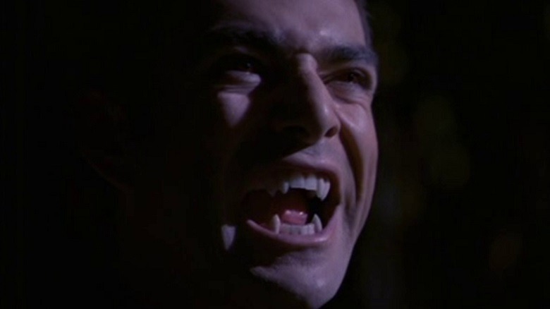 A vampire bares his fangs