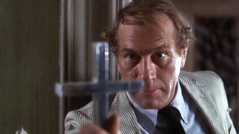 Kolchak repelling a vampire with a crucifix