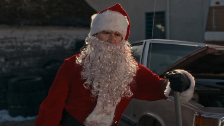Rohan Campbell as Billy standing outside in a Santa Claus suit in Silent Night Deadly Night