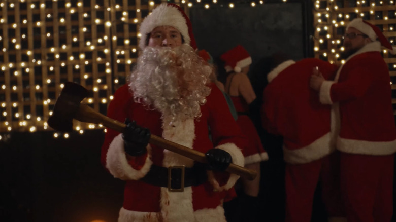 Rohan Campbell as Santa with his ax getting ready to kill everyone at the Nazi party in Silent Night, Deadly Night (2025)