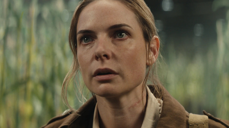 Rebecca Ferguson as Juliette Nichols looking alarmed while surrounded by corn stalks in Silo