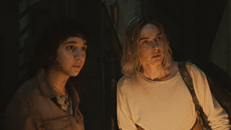 Eater and Juliet stand together in a granary