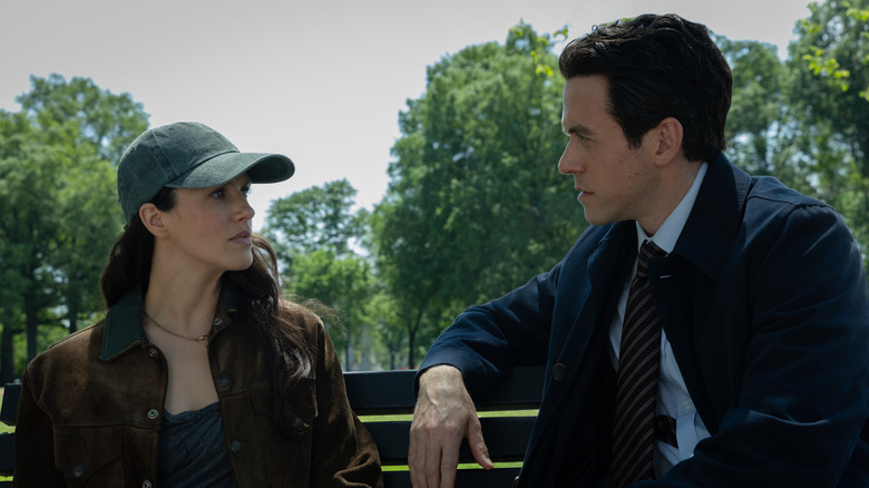 Daniel and Charlotte talking at a park in a very clearly non-apocalyptic landscape in Silo