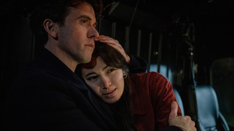 Ashley Zuckerman as Daniel Keene hugging Jessica Henwick as Helen Drew in Silo