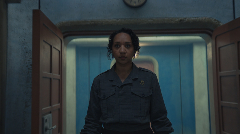 Camille walking into the IT room with the creepy AI voice in Silo