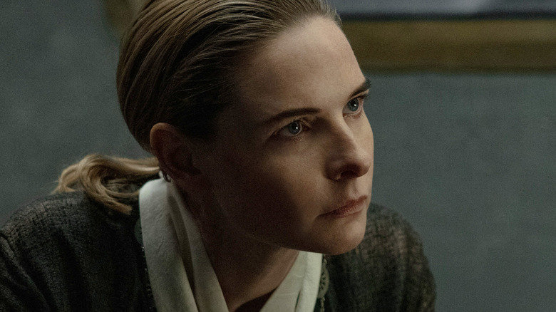 Rebecca Ferguson as Juliette Nichols sitting in a chair and looking intense in Silo