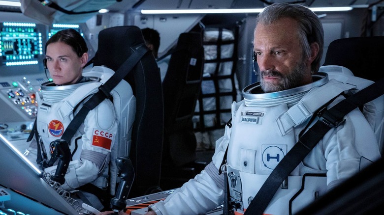 Irina and Ed in astronaut suits in a cockpit on For All Mankind