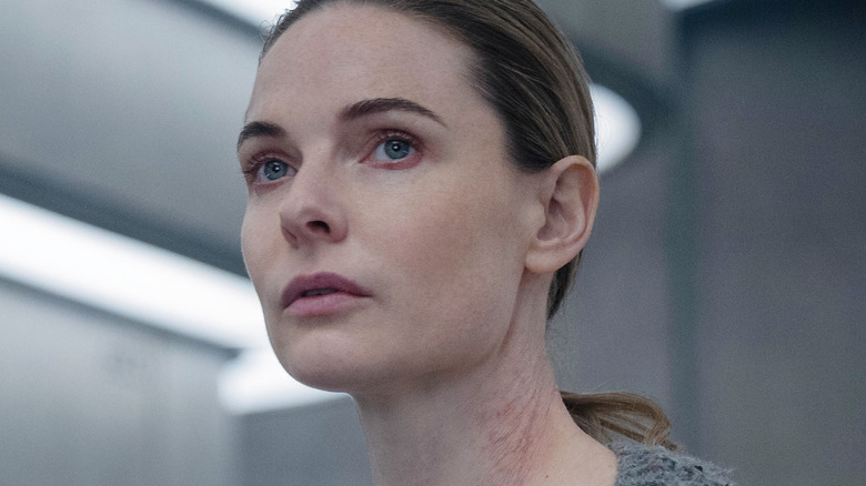 Juliette Nichols looking concerned with scars on her neck in Silo