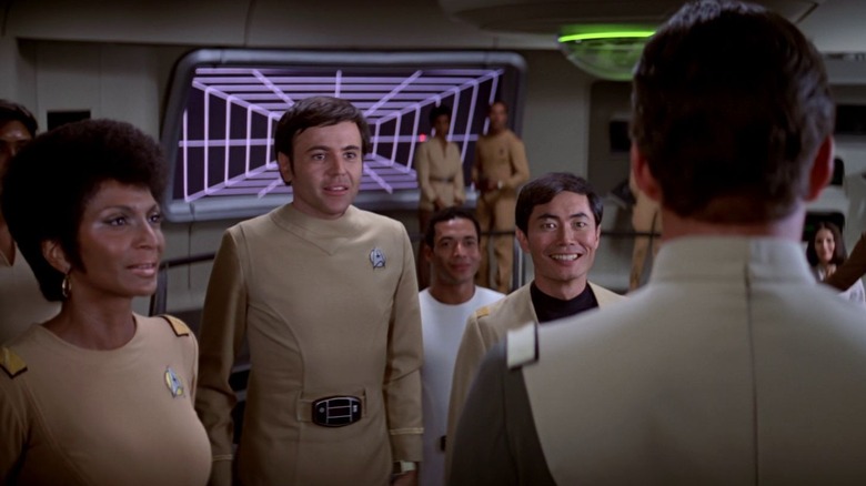 Uhura, Chekov and Sulu, greeting Admiral Kirk on the Bridge of the Foundation