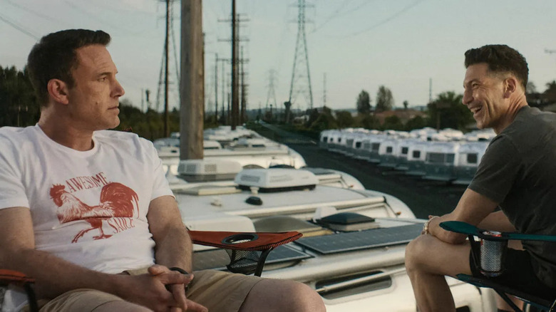 Ben Affleck's Christian Wolff and Jon Bernthal's Braxton sitting on the roof of a trailer in The Accountant 2