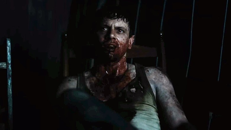 Remimick (Jack O'Connell) covered with sinful blood