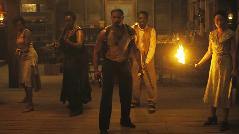 Jayme Lawson as Pearline, Wunmi Mosaku as Annie, Michael B. Jordan as Smoke, Miles Caton as Sam and Li Jun Li as Grace prepare to battle vampires in Sinners