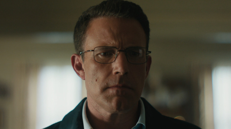 Ben Affleck as Christian Wolff staring at an evidence board in The Accountant 2