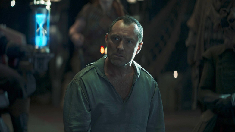 Jod stands on his knees and looks worried as he considers his fate in Star Wars: Skeleton Crew