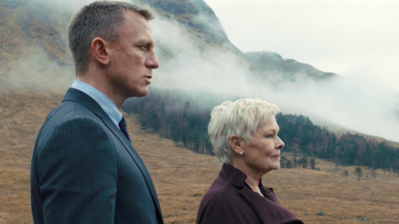 Daniel Craig and Dame Judi Dench look out in the distance in Skyfall