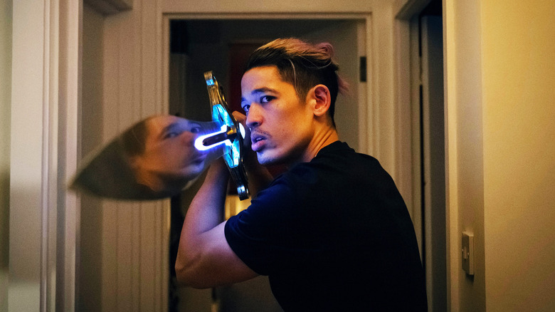 Christopher Chung's Roddy Ho holds up a sword in Slow Horses