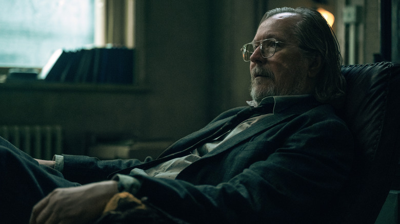 Jackson Lamb (Gary Oldman) sat in his office chair in Slow Horses