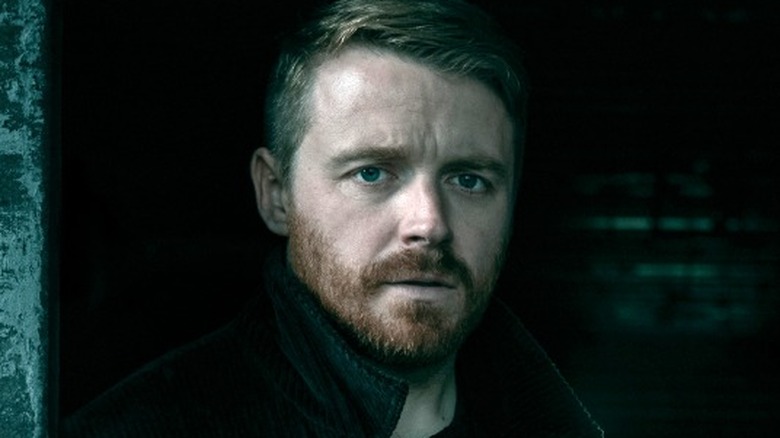 Jack Lowden staring down the camera lens in a promo photo for Slow Horses Season 6