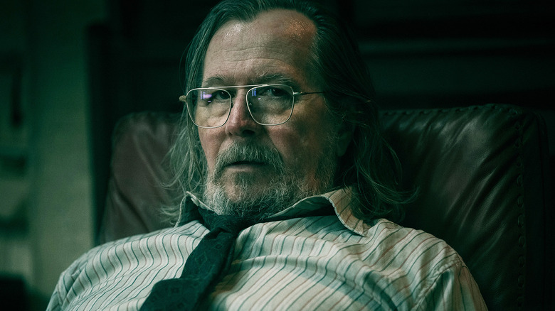 Gary Oldman's Jackson Lamb is seen in closeup as he sits in his office in Slow Horses