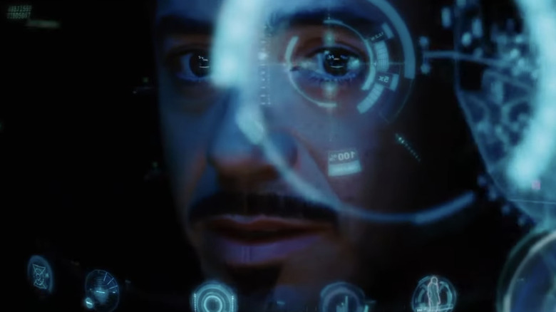 Robert Downey Jr.'s Tony Stark looks through crosshairs in the heads-up display of his suit in Iron Man