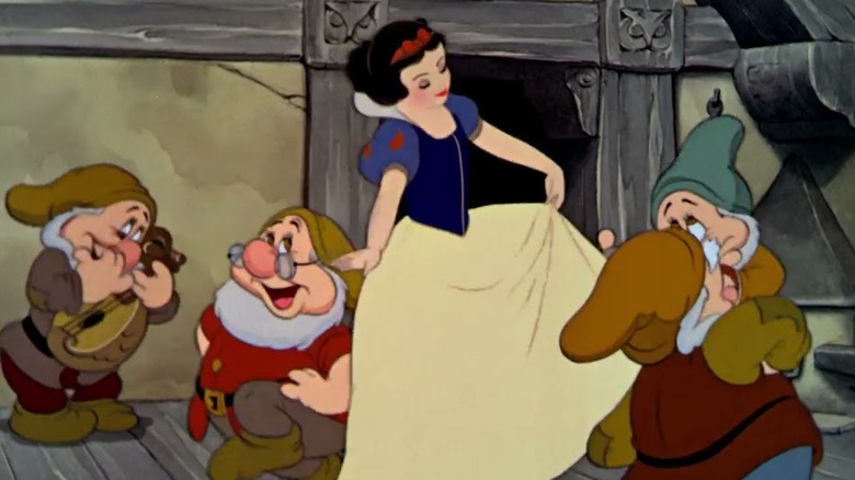 Snow White dancing with the dwarfs in Snow White and the Seven Dwarfs