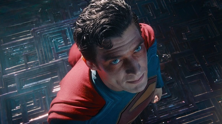 David Corenswet as Superman looking up with bruises on his eyes in Superman