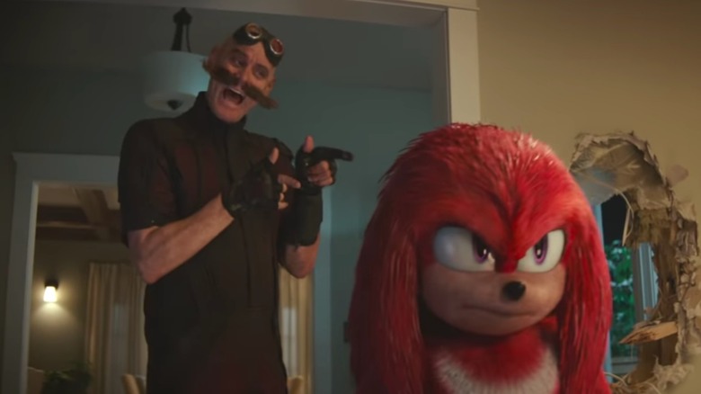 Doctor Robotnik points to Knuckles