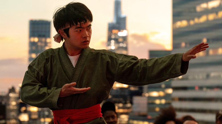 Ben Wang as Li Fong practicing his movies on a rooftop in Karate Kid: Legends
