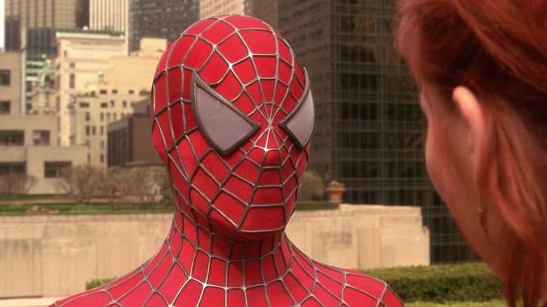 Tobey Maguire's Spider-Man stands talking to Kirstin Dunst's Mary Jane in Spider-Man